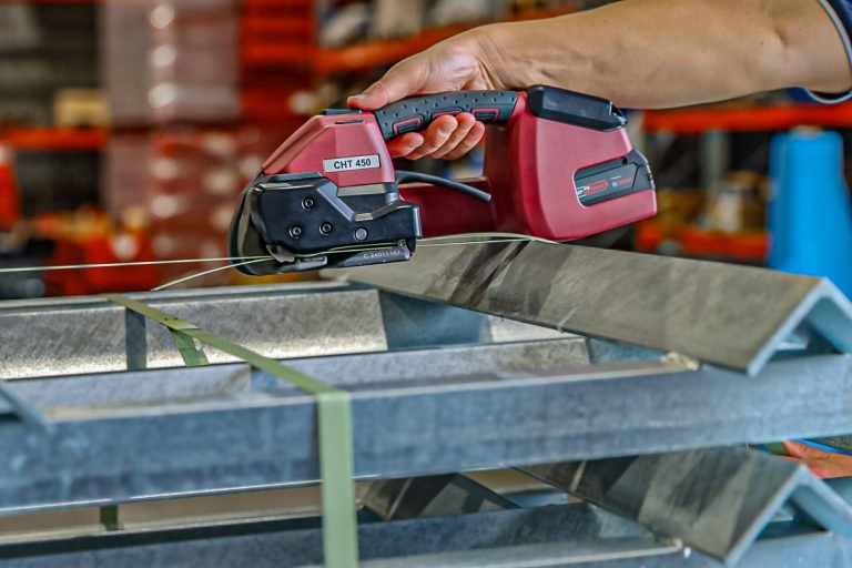 Person using PET automatic strapping tool