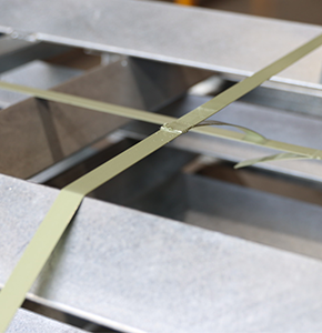 PET strapping on steel